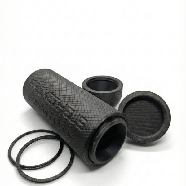 Black tube on its side with three rings.