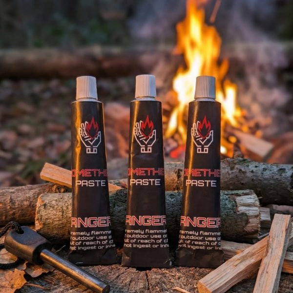 Three bottles of methanol on a forest camping site.