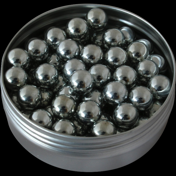 Glass jar filled with metal spheres.