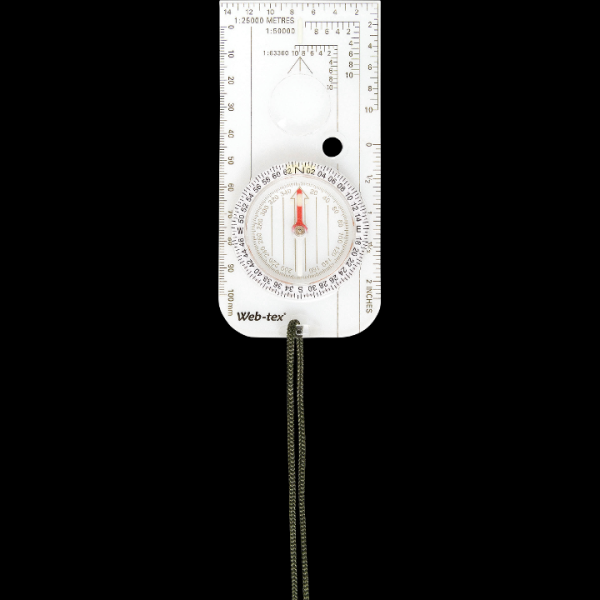A compass mounted on a small wooden stand in the woods.